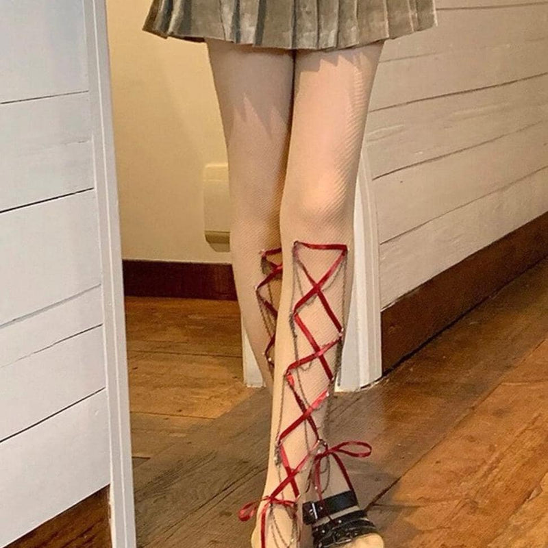 Women's edgy crisscross strappy cut-out fishnet tights