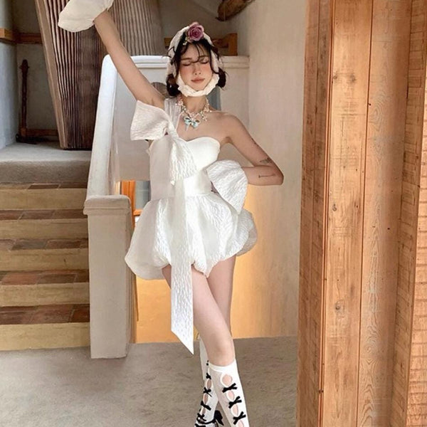 Vintage-style, slimming, over-the-knee socks featuring a flocked bow, cut-out details, and lace accents.