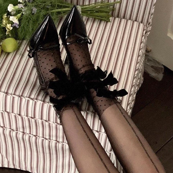 Sheer mid-calf socks featuring a velvet bow, mesh texture, and polka-dot fairy-style design