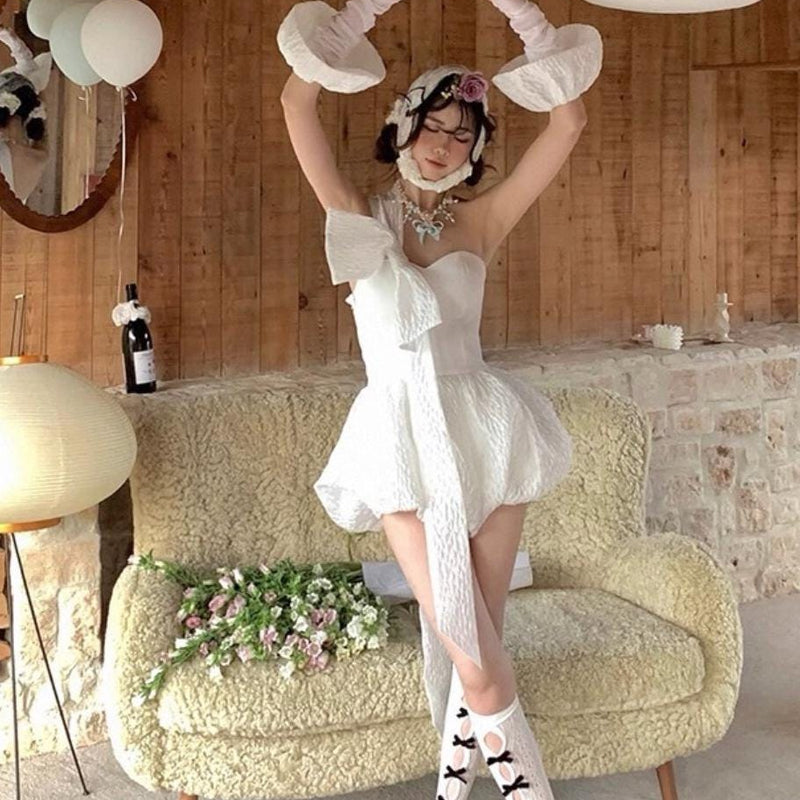 Vintage-style, slimming, over-the-knee socks featuring a flocked bow, cut-out details, and lace accents.