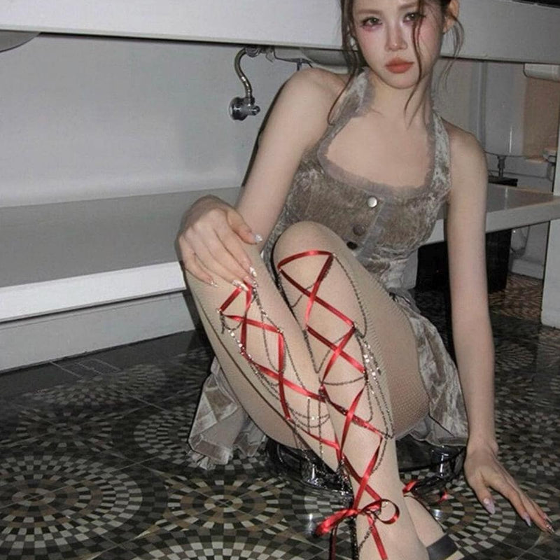 Women's edgy crisscross strappy cut-out fishnet tights