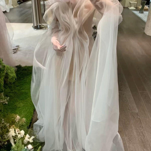 High-fashion engagement/birthday gown featuring intricate pleating, sheer mesh, a sexy open back, and a high-slit maxi skirt.