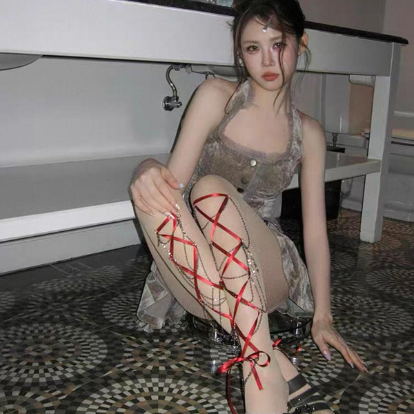 Women's edgy crisscross strappy cut-out fishnet tights